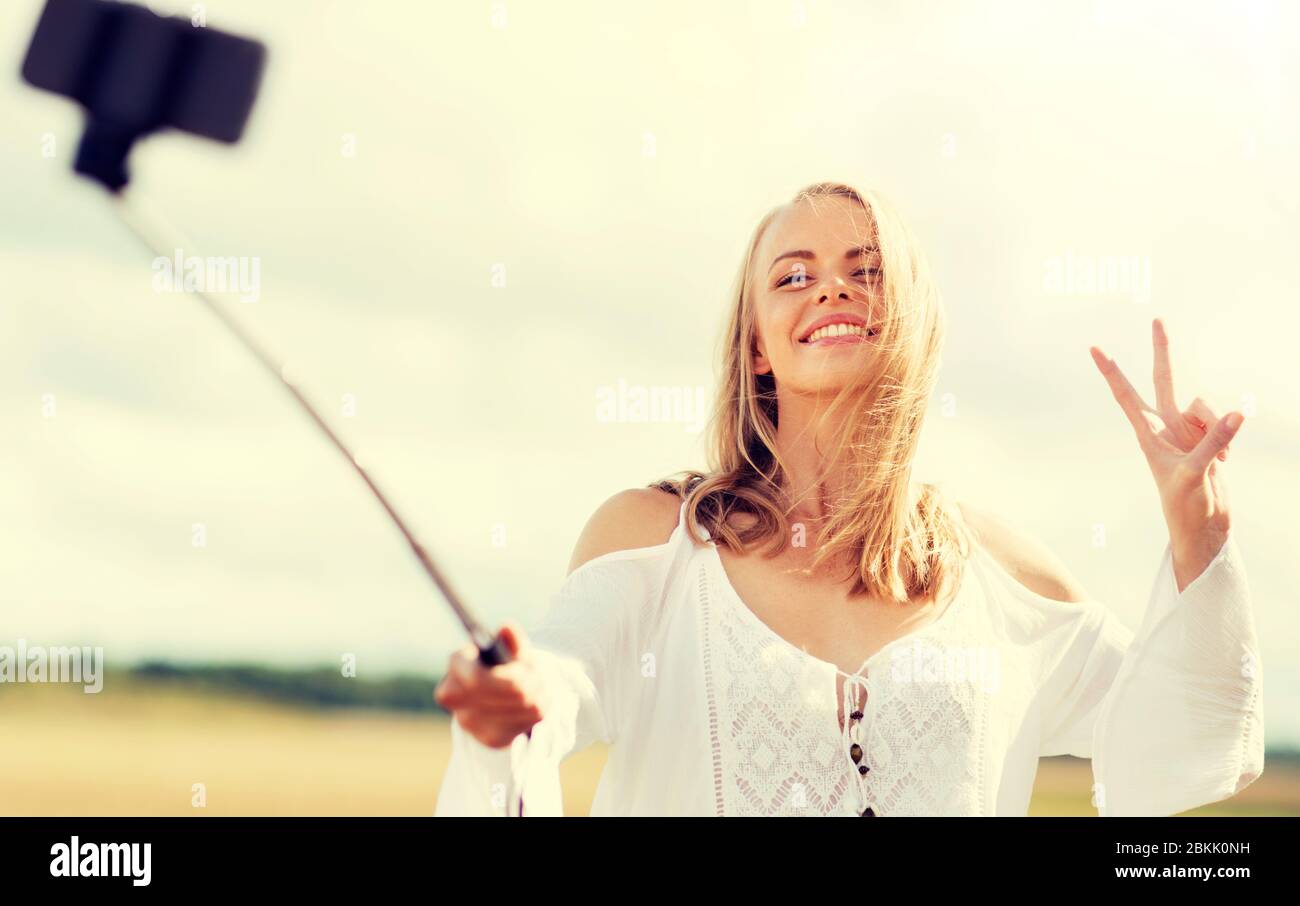 happy young woman taking selfie by smartphone Stock Photo - Alamy