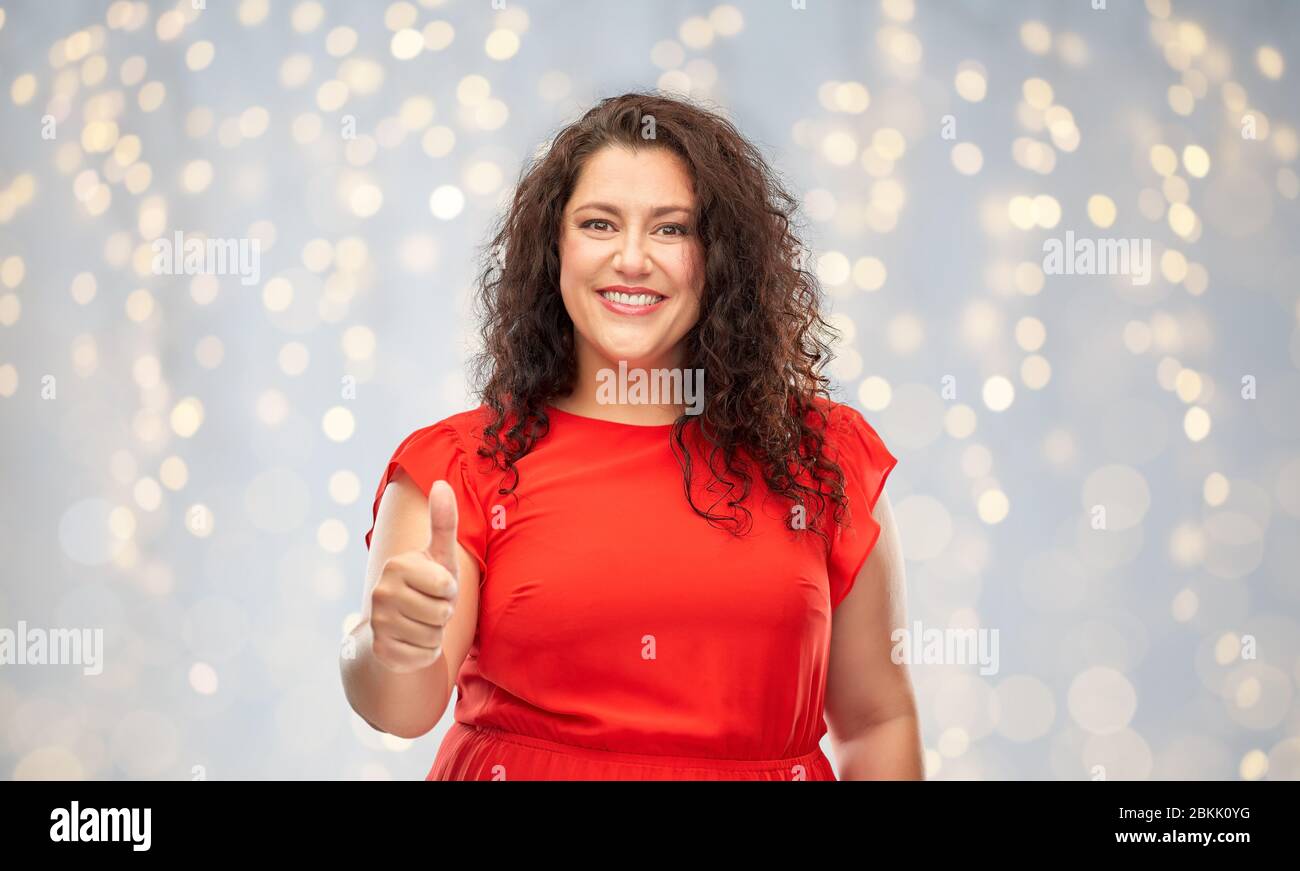 Curly hair woman thumbs up hi-res stock photography and images - Alamy