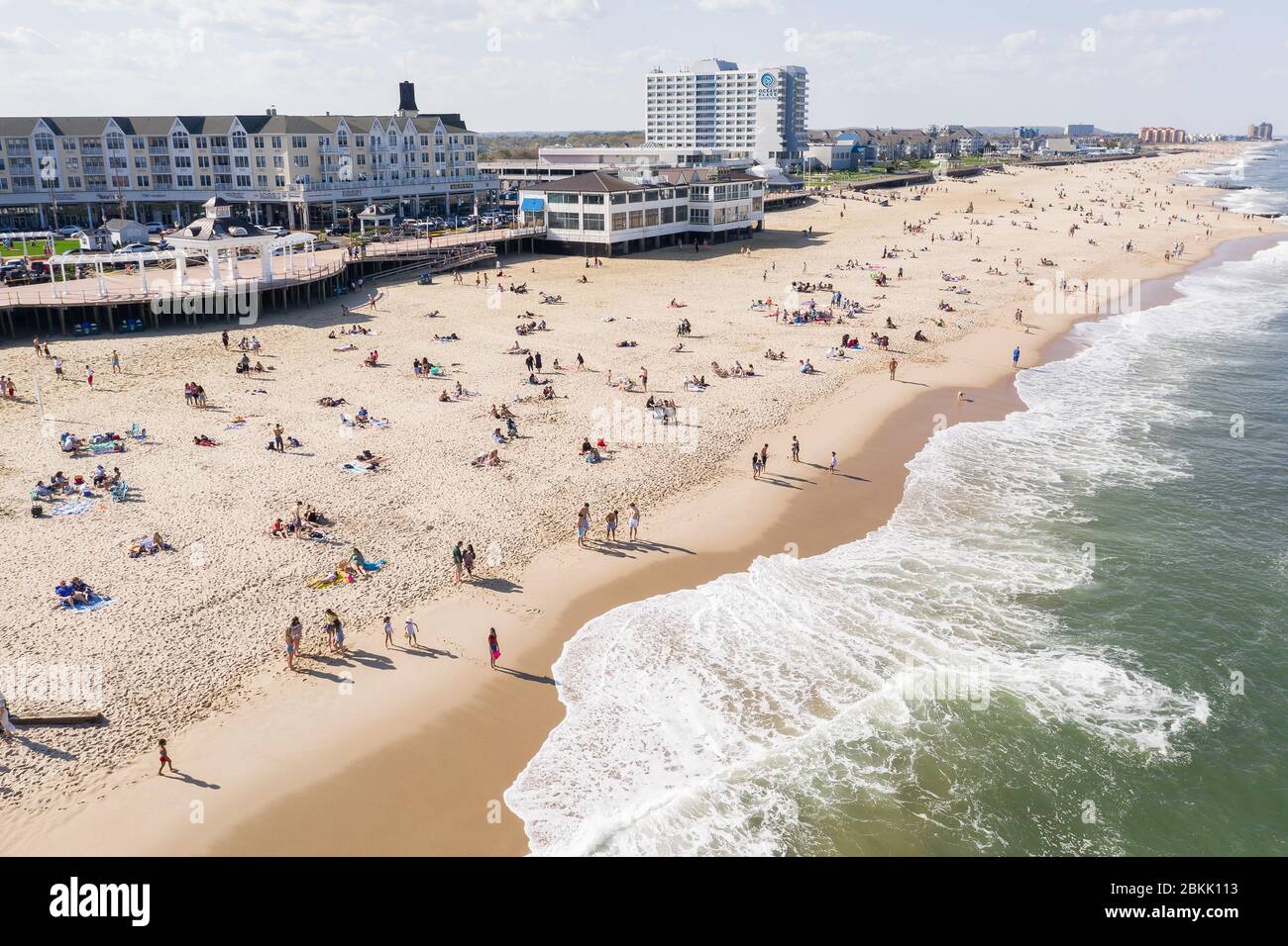 Aerial view of a crowded Jersey Shore beach in Long Branch, New Jersey.  Despite the Coronavirus pandemic beachgoers flocked to the shore amidst the  warm weather and recent beach re-openings Stock Photo 