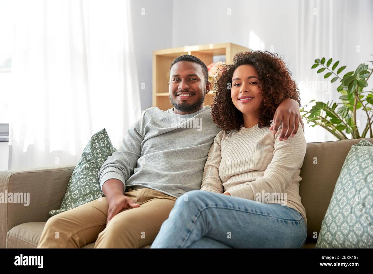happy african american couple hugging at home Stock Photo - Alamy