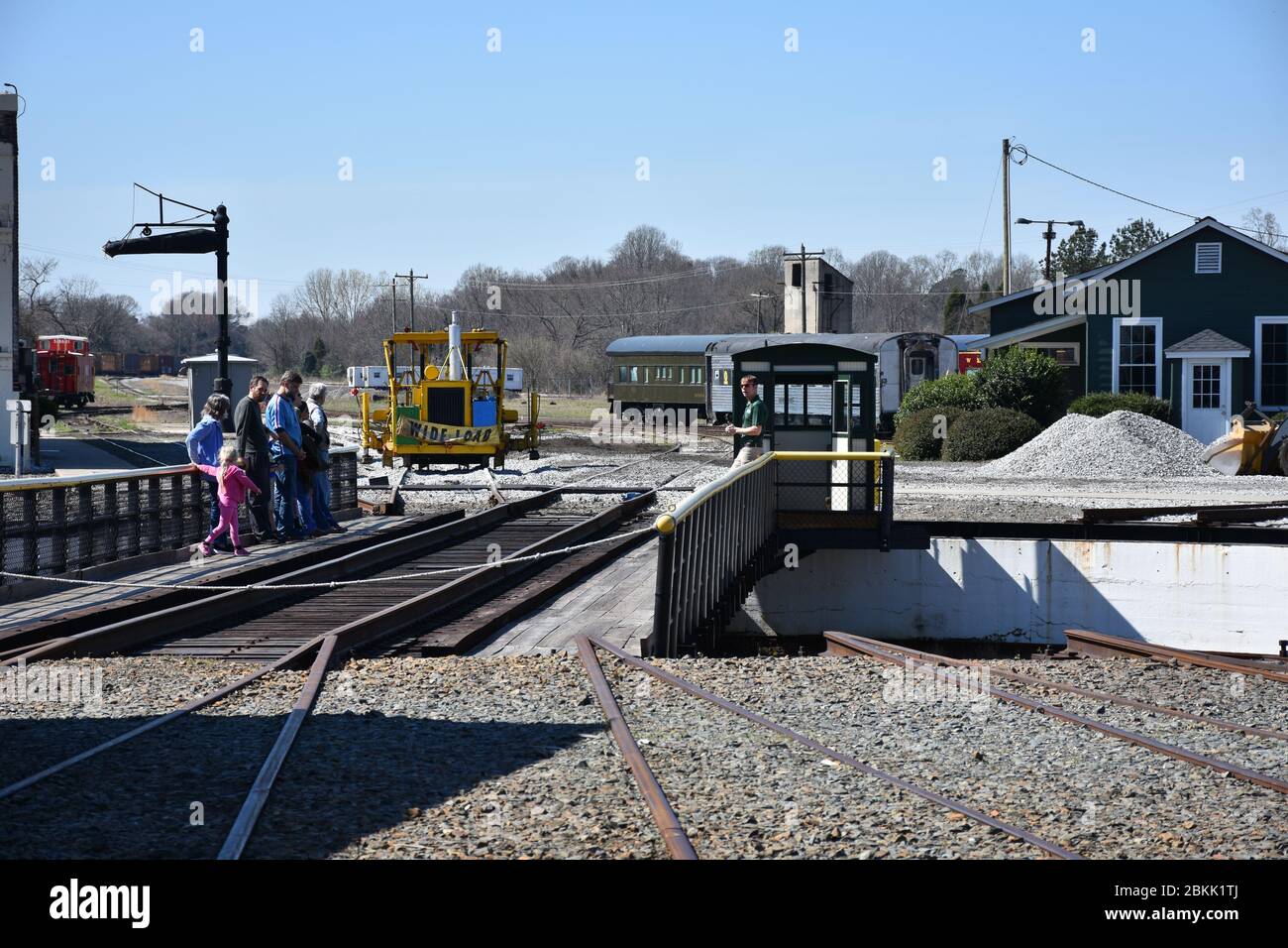 Tourist riding the Turntable at the North Carolina Transportation Museum. Stock Photo