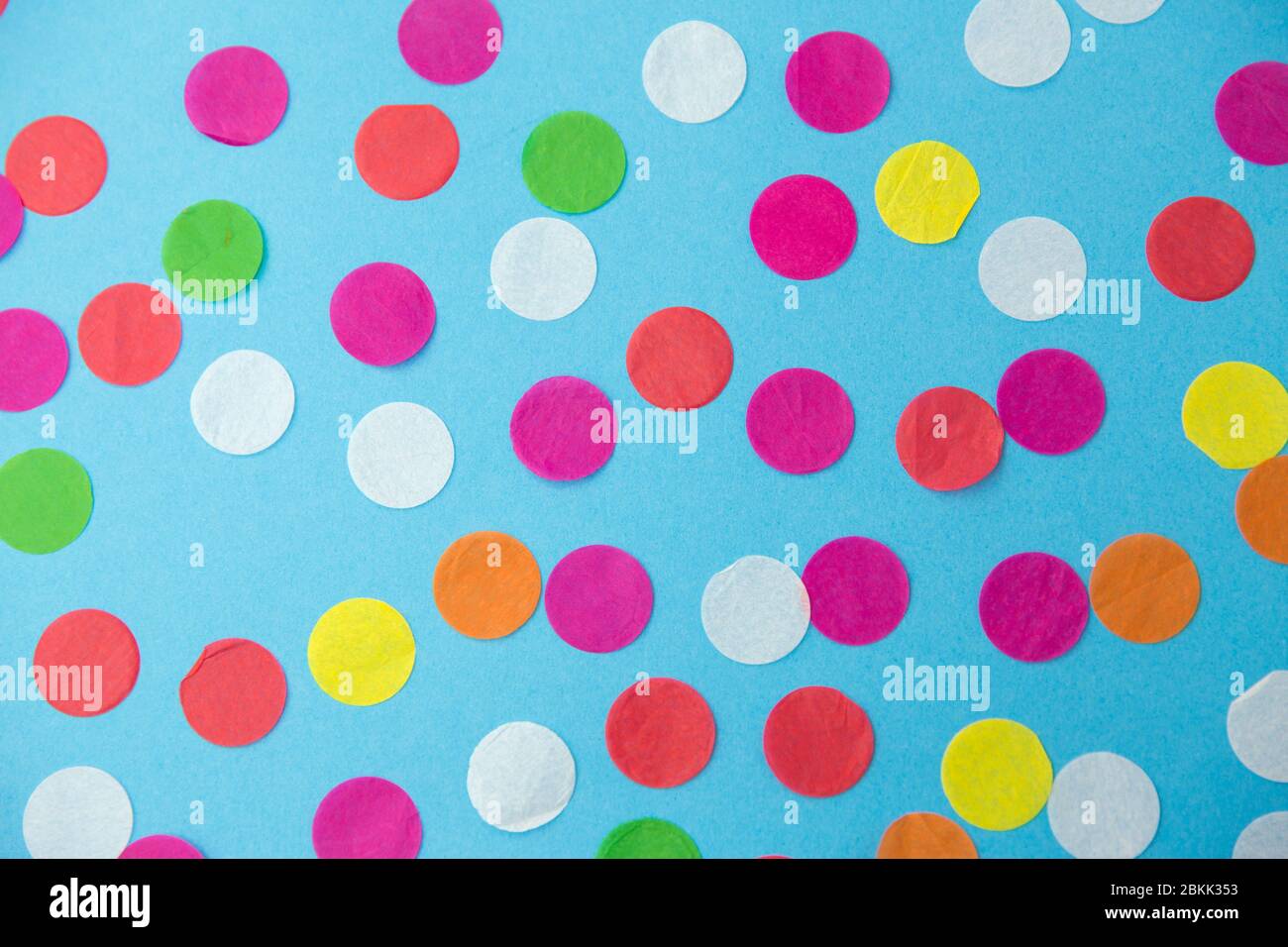 colorful confetti decoration on blue background Stock Photo - Alamy