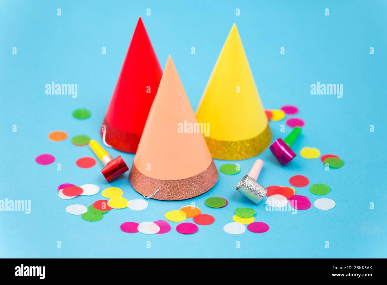 birthday party caps, horns and colorful confetti Stock Photo - Alamy