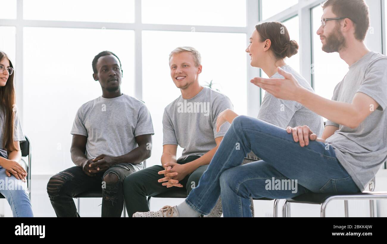 group of young like-minded people discussing their ideas Stock Photo