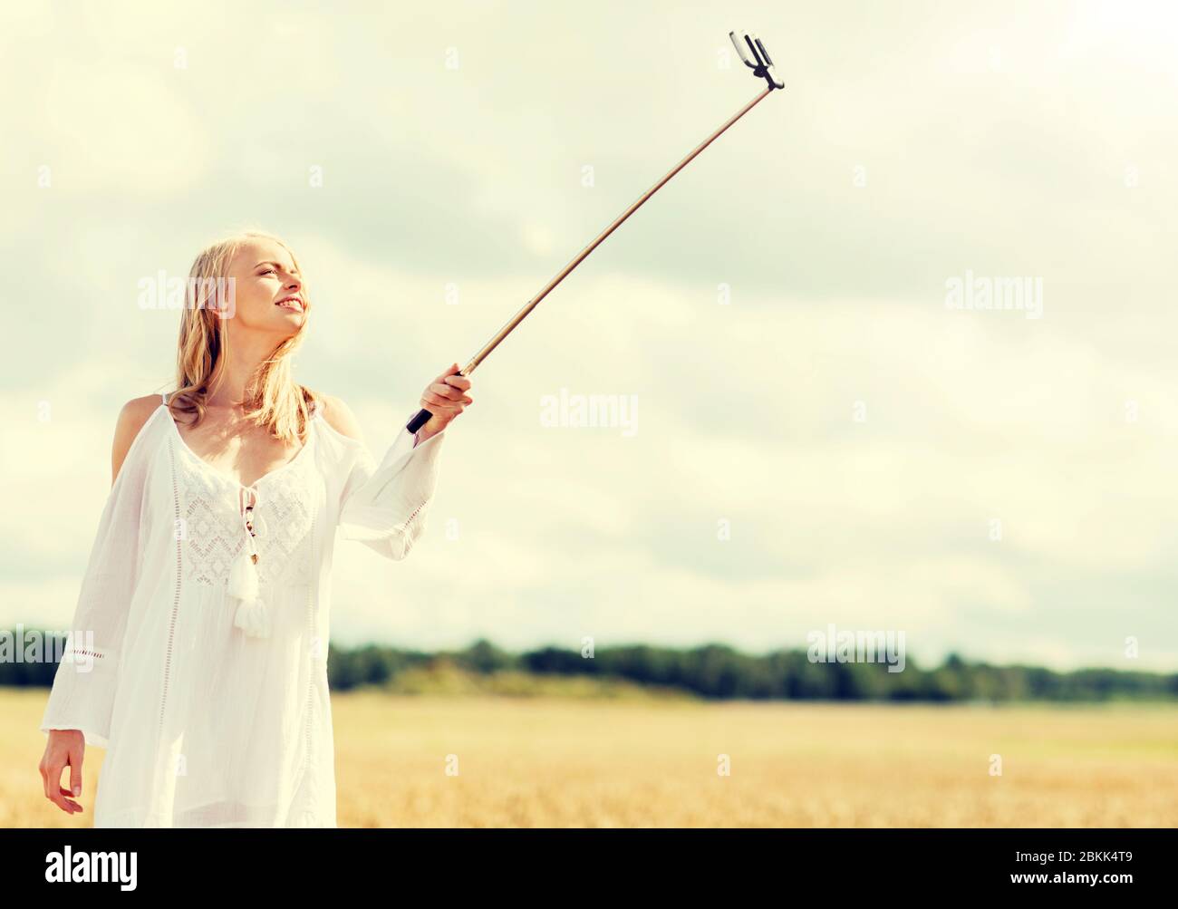 happy young woman taking selfie by smartphone Stock Photo - Alamy