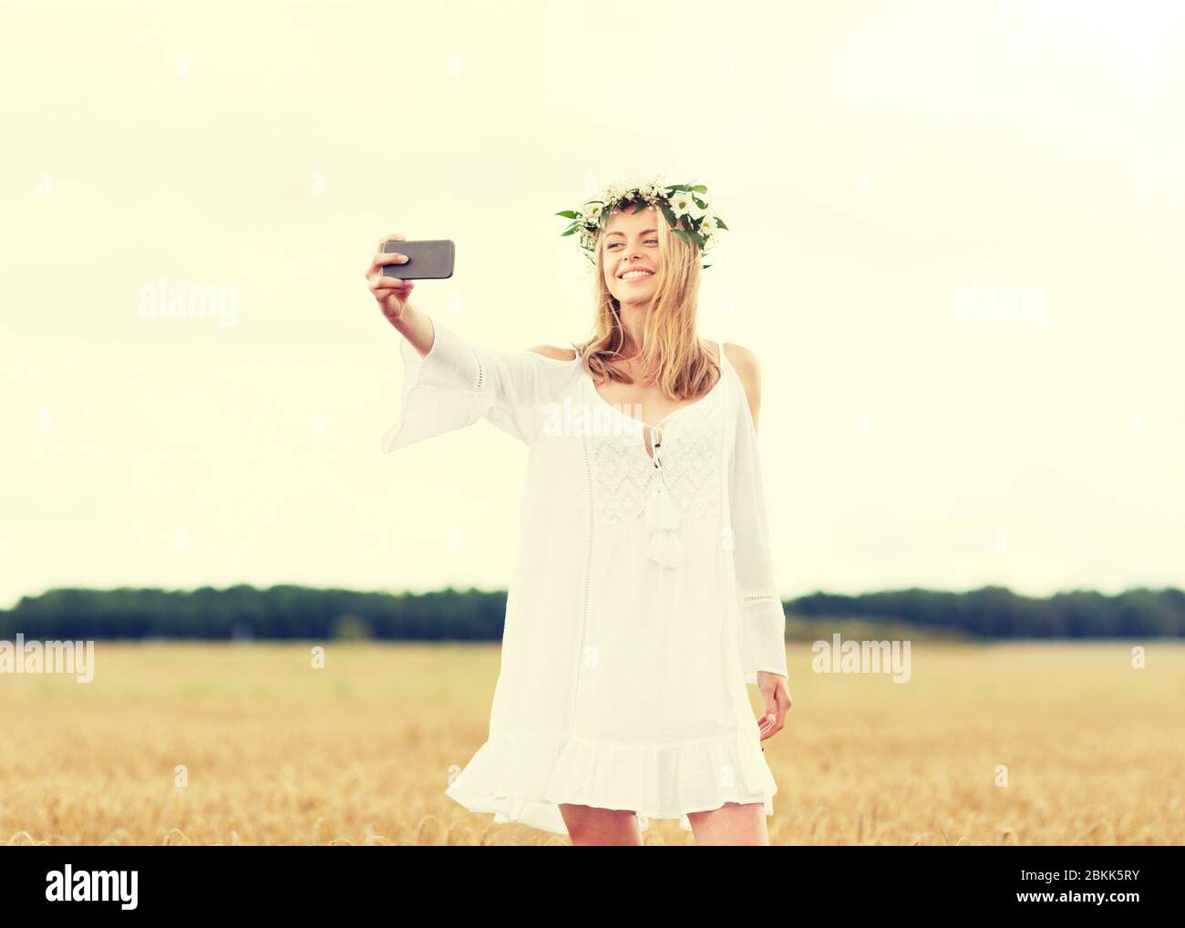 happy young woman taking selfie by smartphone Stock Photo - Alamy