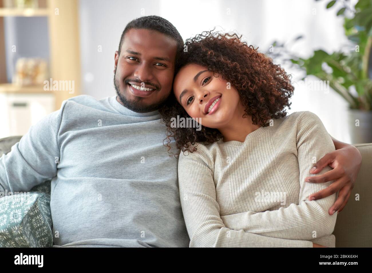 happy african american couple hugging at home Stock Photo - Alamy