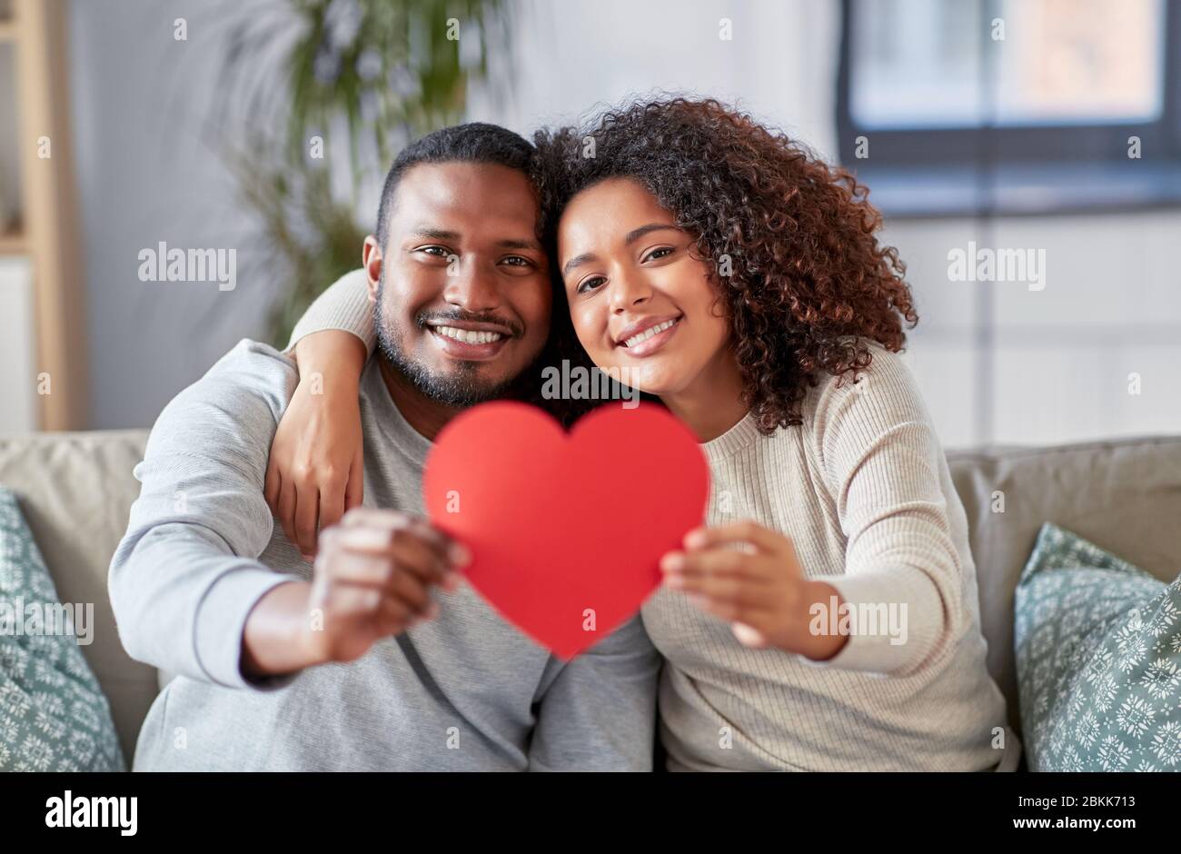 happy african american couple with heart at home Stock Photo - Alamy