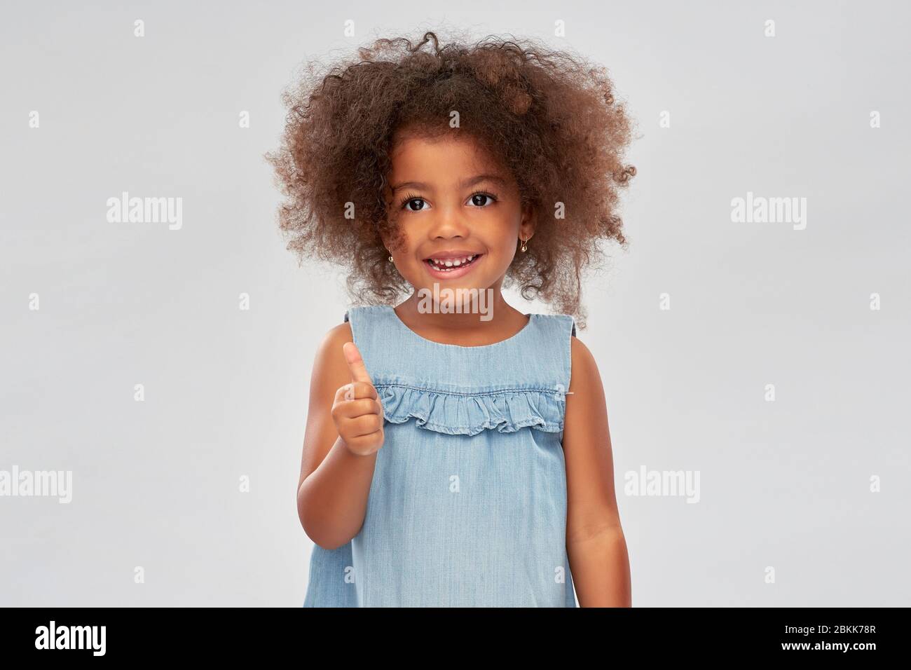 little african american girl showing thumbs up Stock Photo - Alamy