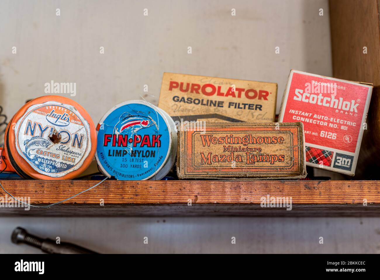 Swift Current, SK/Canada- May 1, 2020: Boxes and spools of vintage products:  Mazda lamps, fishing line, gasoline filters and auto-electric connectors Stock Photo