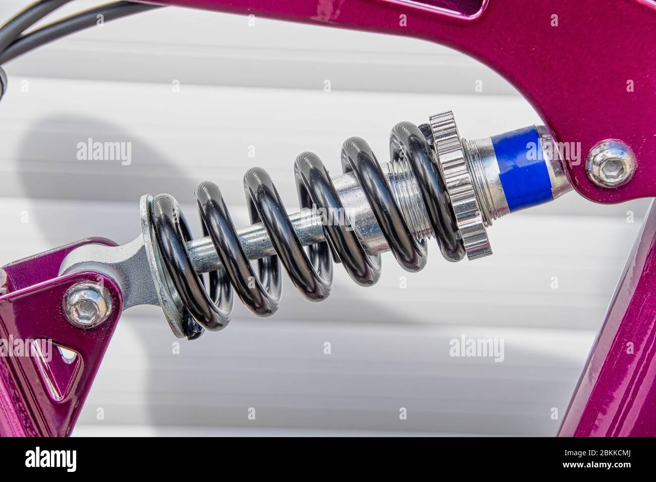 A close view of a bicycle rear suspension spring Stock Photo Alamy