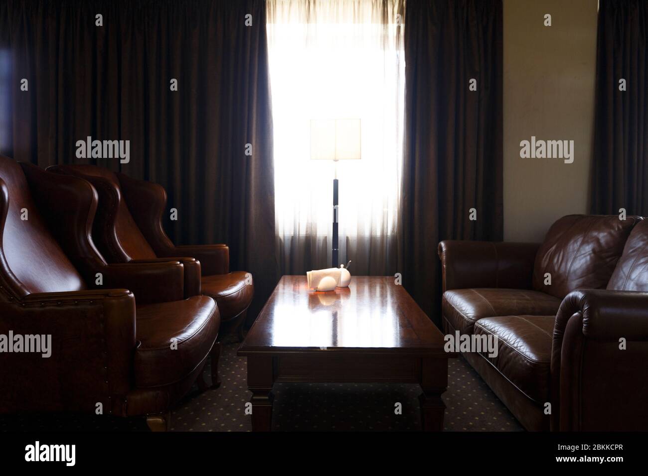 Interior room with leather armchairs and sofa Stock Photo
