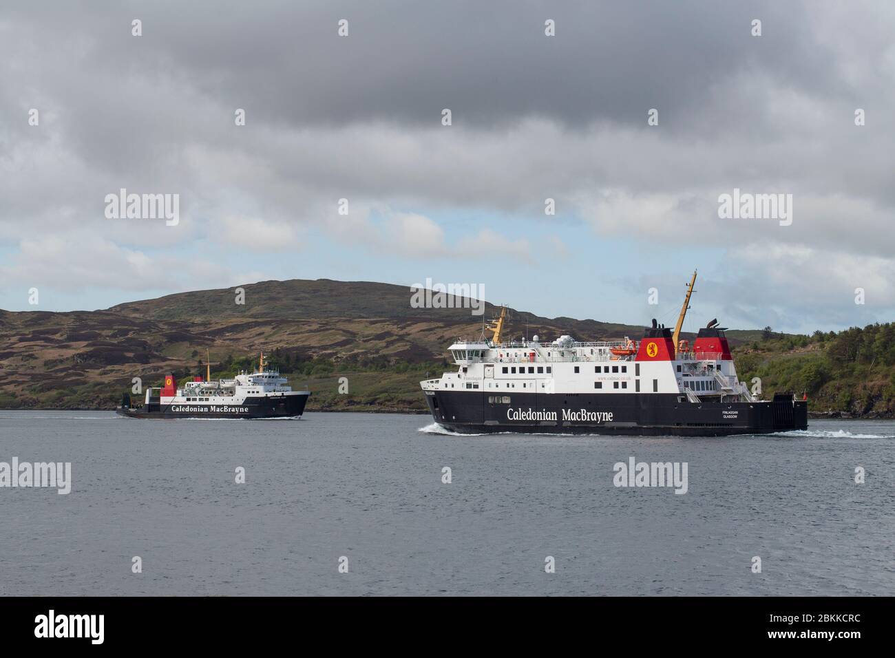 Calmac ferries MV Finlaggan passing MV Hebridean Isles Stock Photo