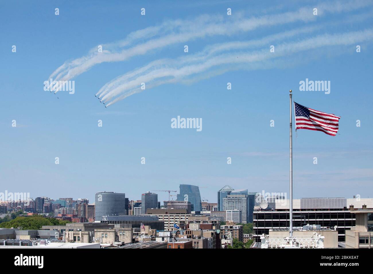 The U.S. Air Force Air Demonstration Squadron, the Thunderbirds, and the Navy Blue Angels, fly in formation over Washington, during the America Strong flyover May 2, 2020 in Washington, D.C. America Strong is a salute from the Navy and Air Force to recognize healthcare workers, first responders, and other essential personnel in a show of national solidarity during the COVID-19 pandemic. Stock Photo