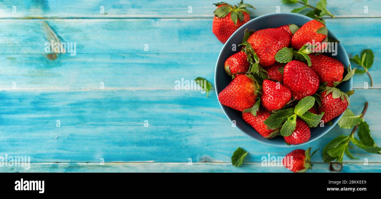 Top veiw of fresh and juicy strawberry on light blue background Stock ...