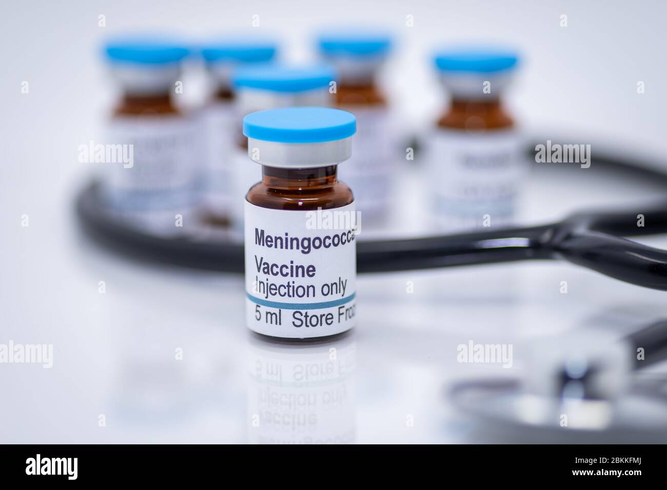 Meningococcal vaccine vial with syringe and stethoscope stock photo Stock Photo