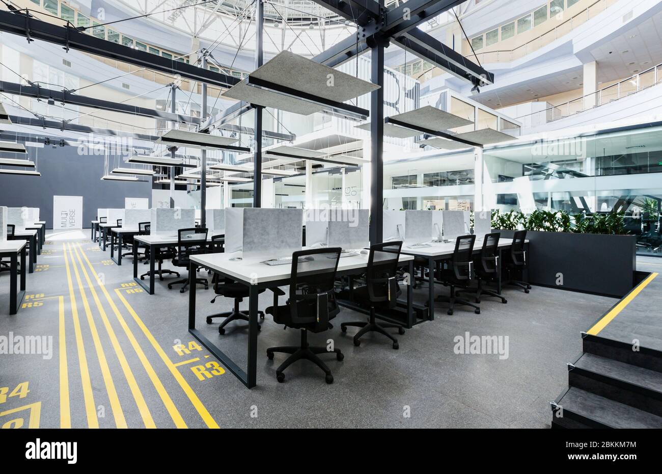 Big rental office with wrapped computers, no workers Stock Photo