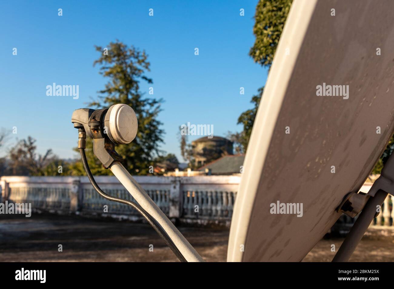 LNB, Satellite Dish over the blue sky in background, selective focus. Stock Photo