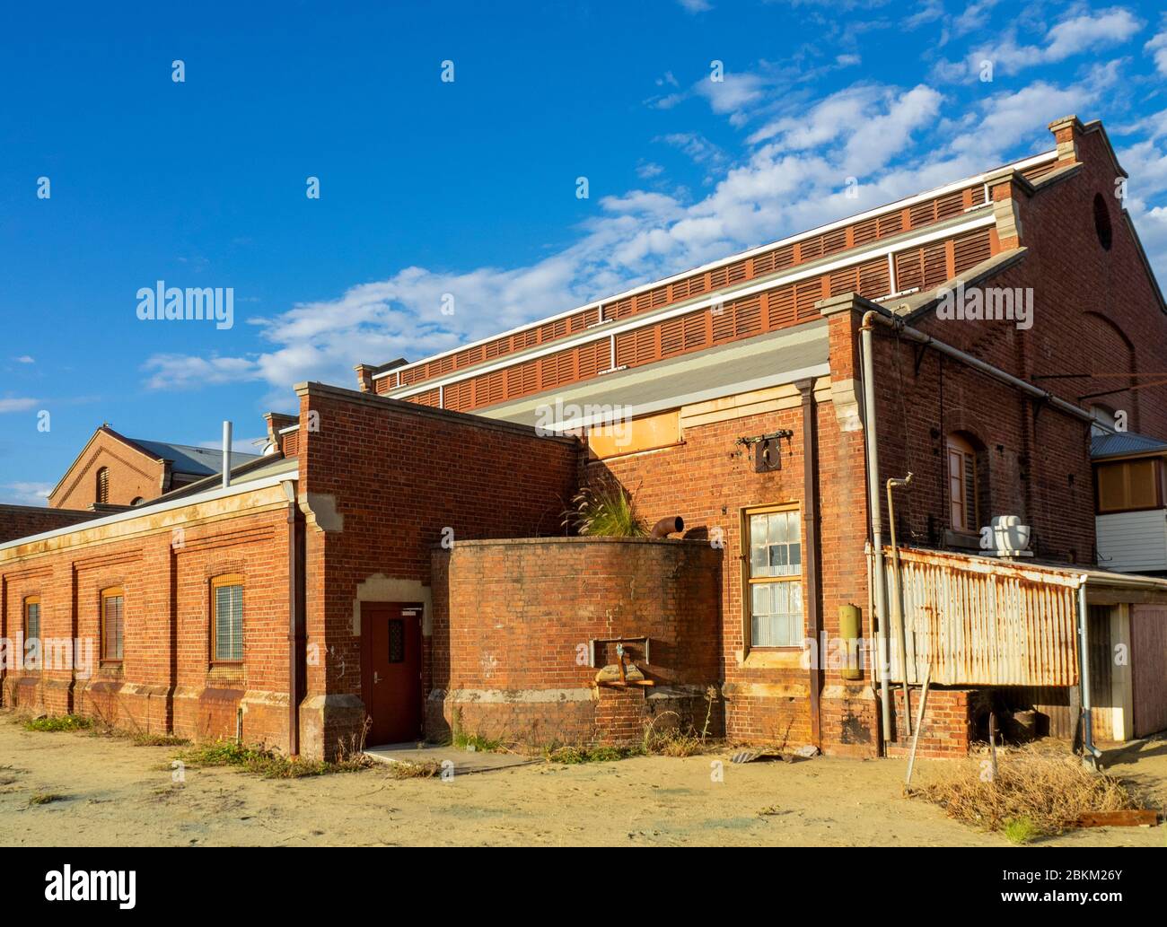 Red brick building Power storage tank at former Railway Workshops Midland Perth Western Stock Photo -