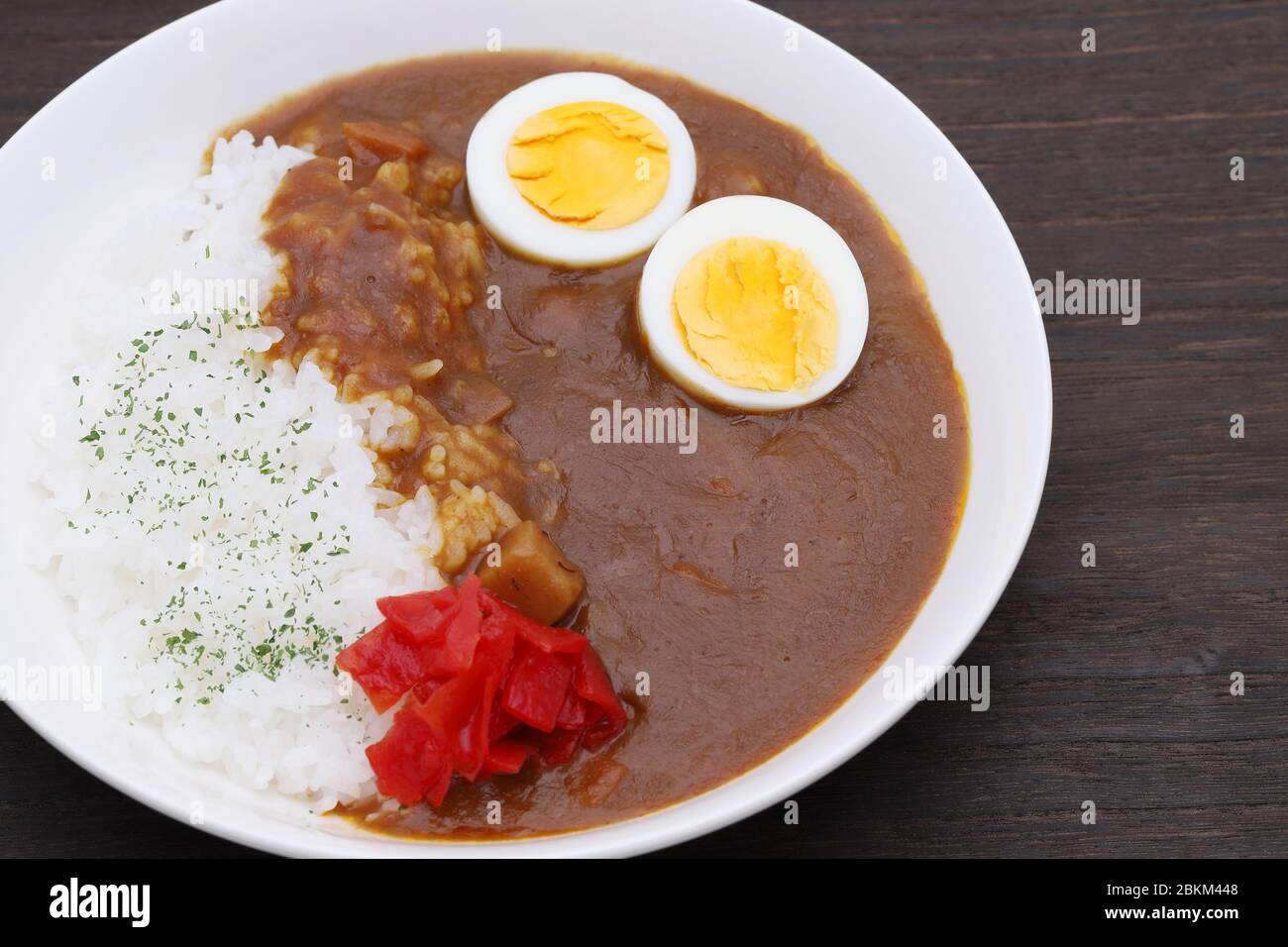 Close up of Japanese curry rice with boiled egg and pickles Stock Photo