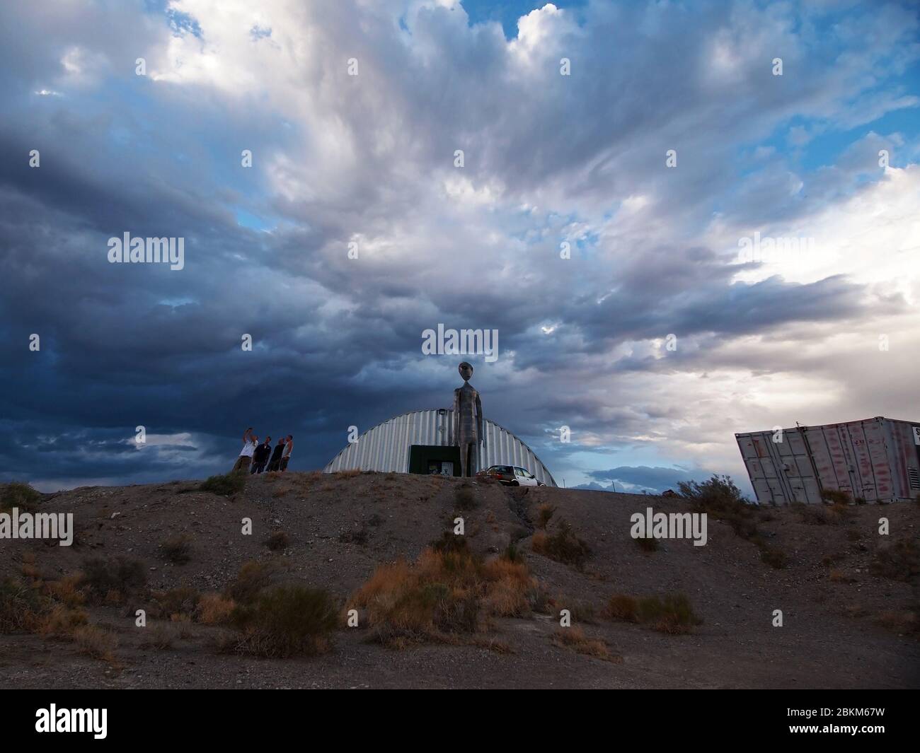 HIKO, NEVADA - JULY 22, 2018: Four men take a selfie together on a cell phone outside the Alien Research Center, an alien themed gift shop, in the Nev Stock Photo