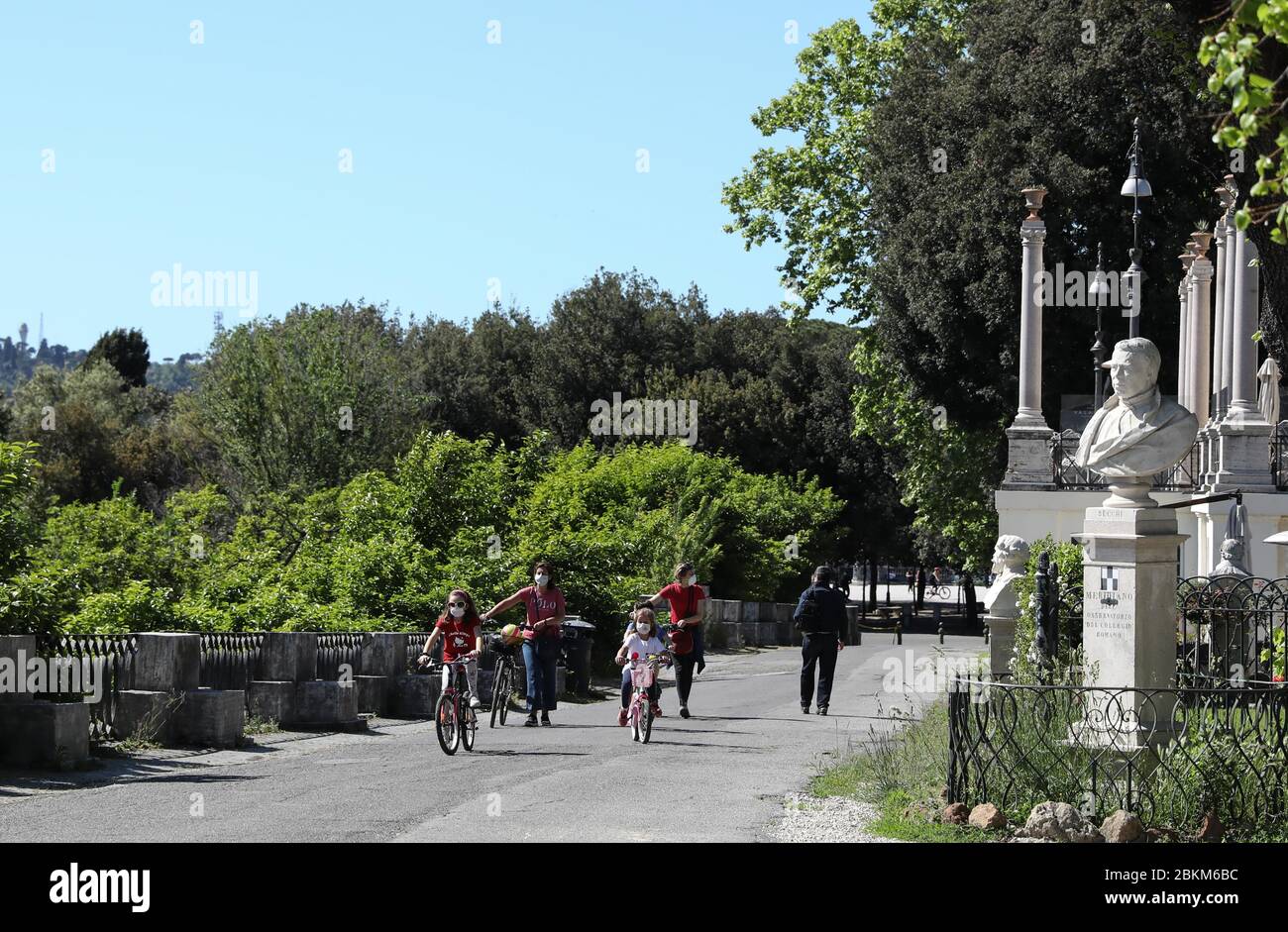 Rome, Italy. 4th May, 2020. Two women and their children cycle in the Villa Borghese park in Rome, Italy, May 4, 2020. The coronavirus pandemic has claimed over 29,000 lives in Italy, bringing the total number of infections, fatalities and recoveries to 211,938 as of Monday, according to the latest data released by the country's Civil Protection Department. Italians enjoyed more liberties on Monday, as some restrictions on productive activities and personal movements were relaxed for the first time after almost eight weeks. Credit: Cheng Tingting/Xinhua/Alamy Live News Stock Photo