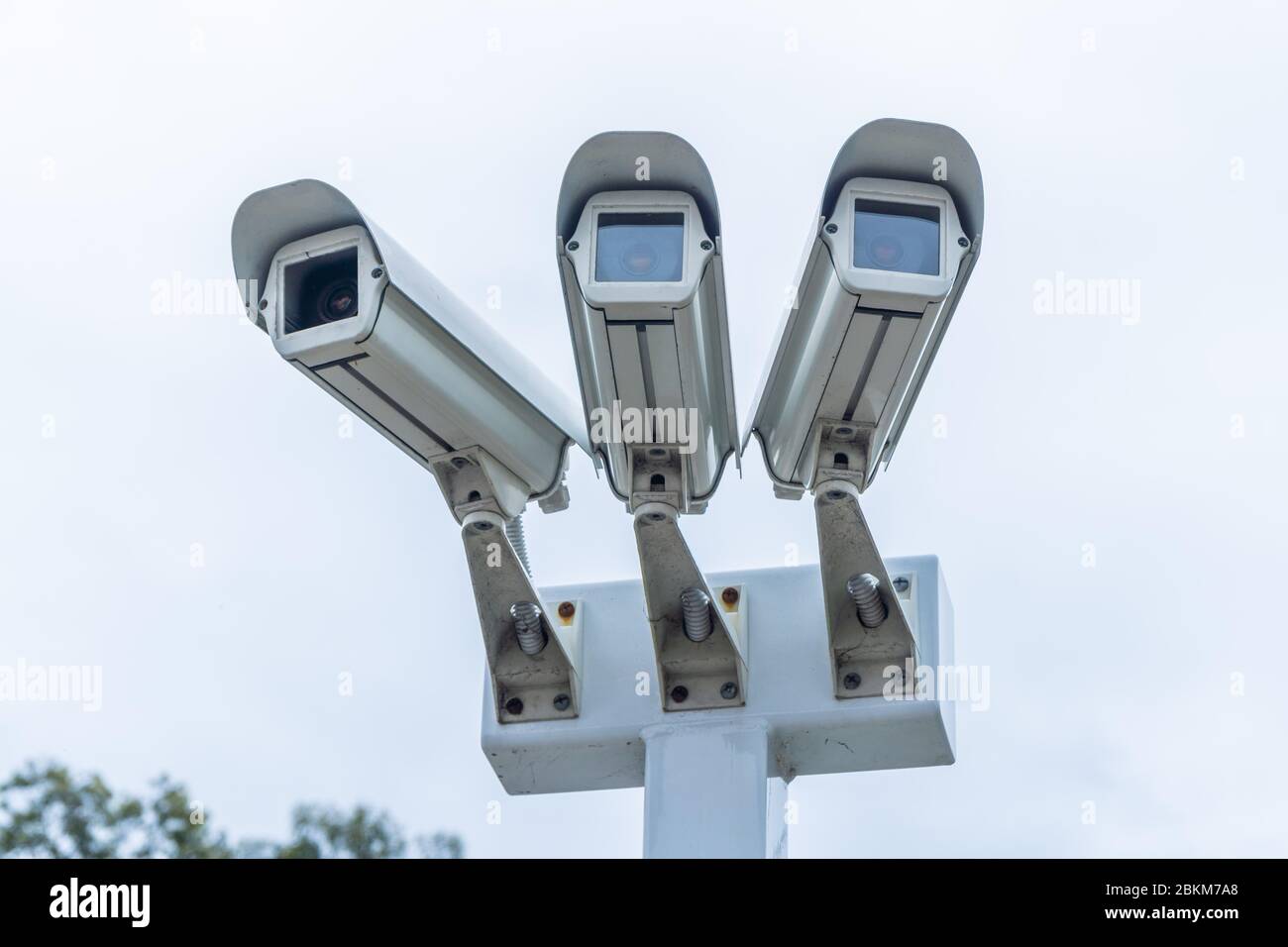 A set of three CCTV security cameras Stock Photo