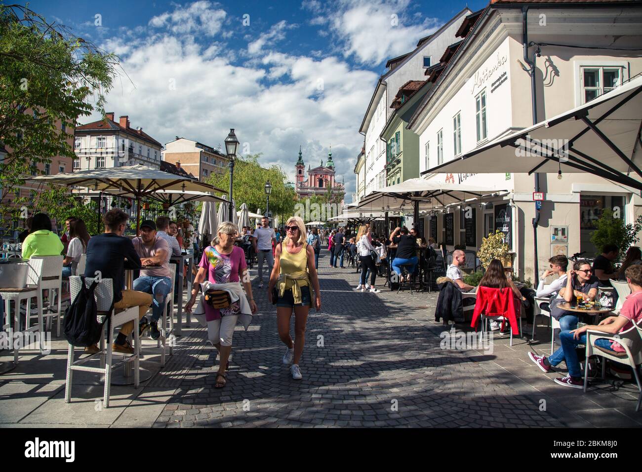 Ljubljana, Slovenia. 04th May, 2020. A couple sit on the outdoor terrace  bar at the city center as Slovenia eases its lockdown. Outdoor terrace  bars, restaurants along with beauty and hair salons,
