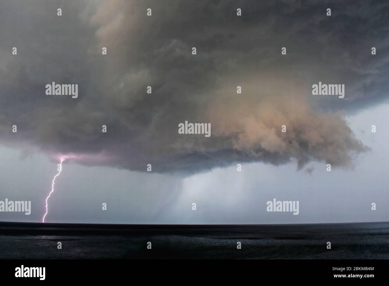 Lightning Bolt coming from Dark Storm Clouds over the sea/ Thunderstorm ...