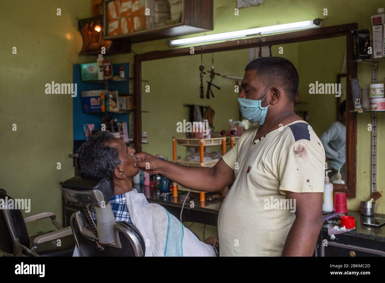 A man getting a shave during the covid-19 lockdown in India Stock Photo