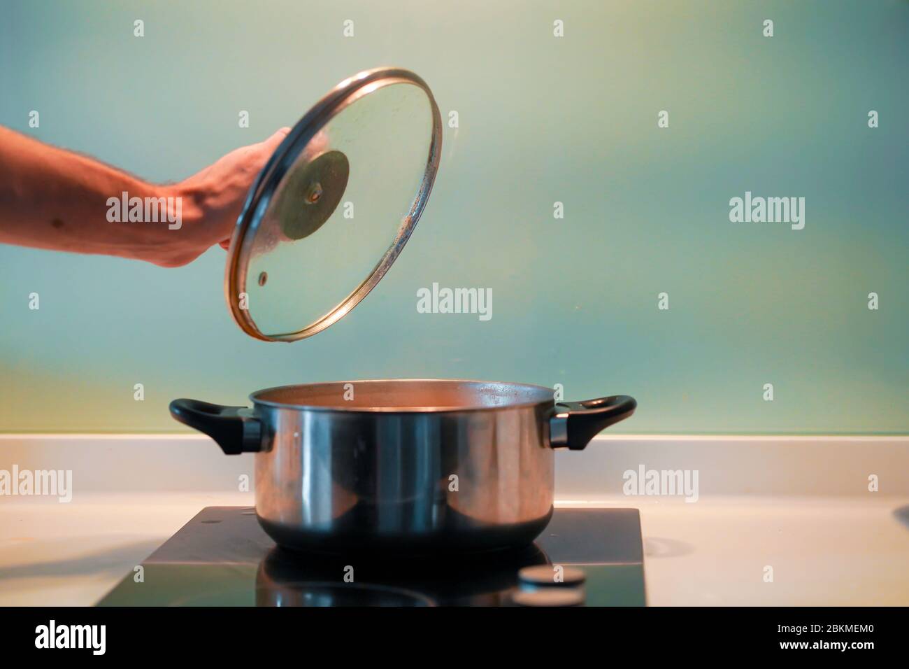 Cooking soup in a pan on an induction stove Stock Photo Alamy