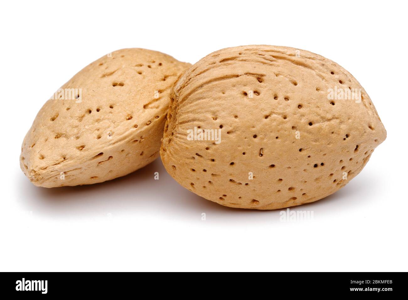 Two almonds isolated on white background. Macro, studio shot Stock Photo