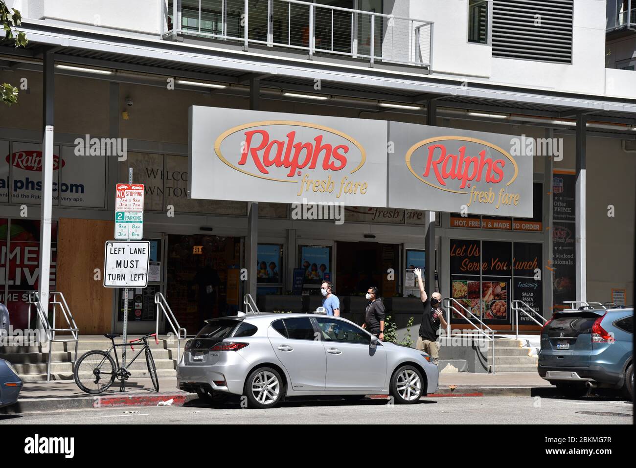 Los Angeles, CA/USA - April 29, 2020: People in face masks in front of