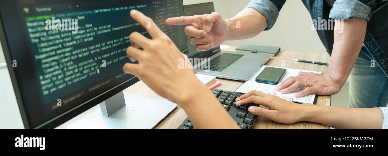 Collaborative work Software engineers website developer technologies or programmer working coding on startup ai application project on screen with par Stock Photo