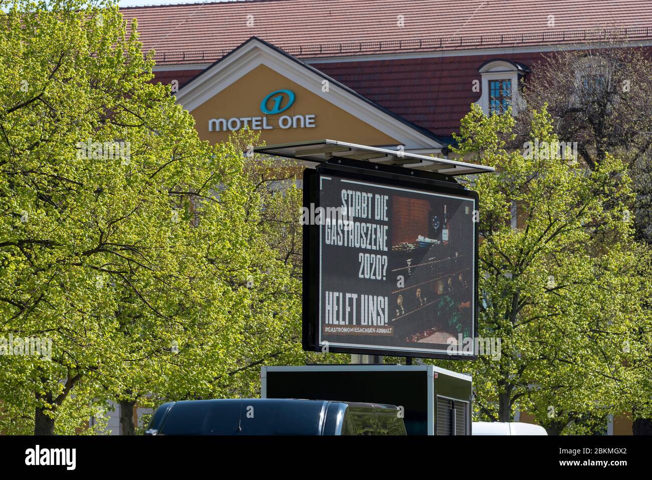 Magdeburg, Germany. 24th Apr, 2020. On a scoreboard there is a question: 'Is the catering industry dying?' In the background you can see the entrance portal to Motel One. Credit: Stephan Schulz/dpa-Zentralbild/ZB/dpa/Alamy Live News Stock Photo