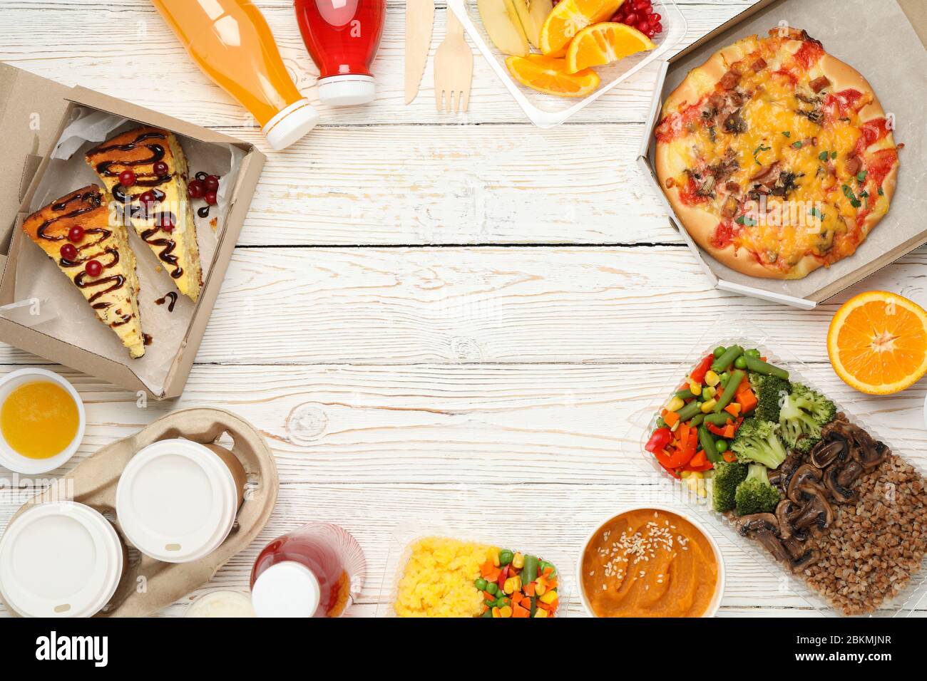 Flat lay with takeaway food on wooden background. Food delivery Stock Photo