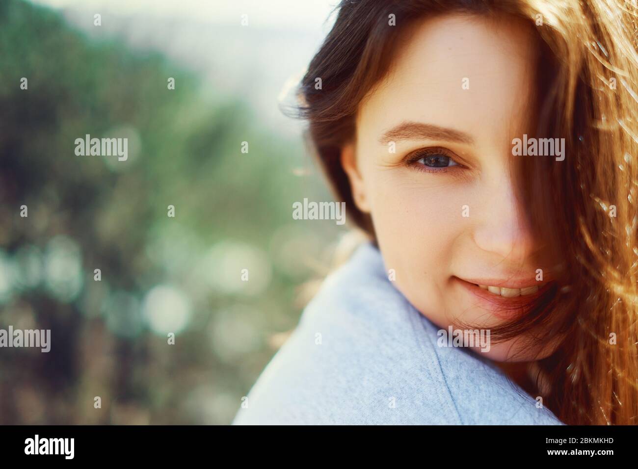 Portrait of a smiling girl looking at the camera. close-up Stock Photo ...