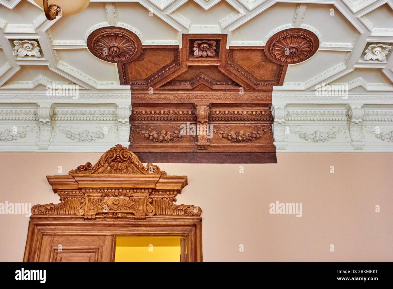 Old wooden ceiling with one part left unpainted as it used to be long ...