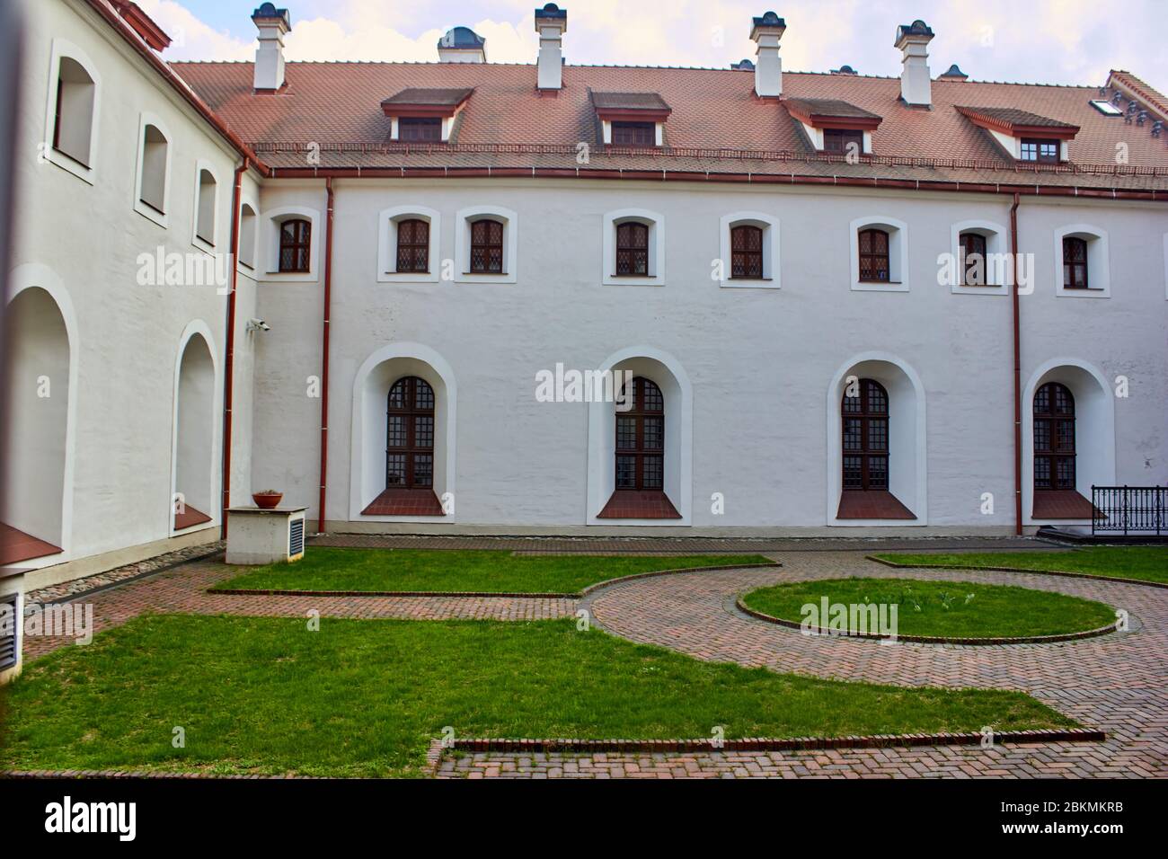 Inside small garden with pathways inside buildings Stock Photo