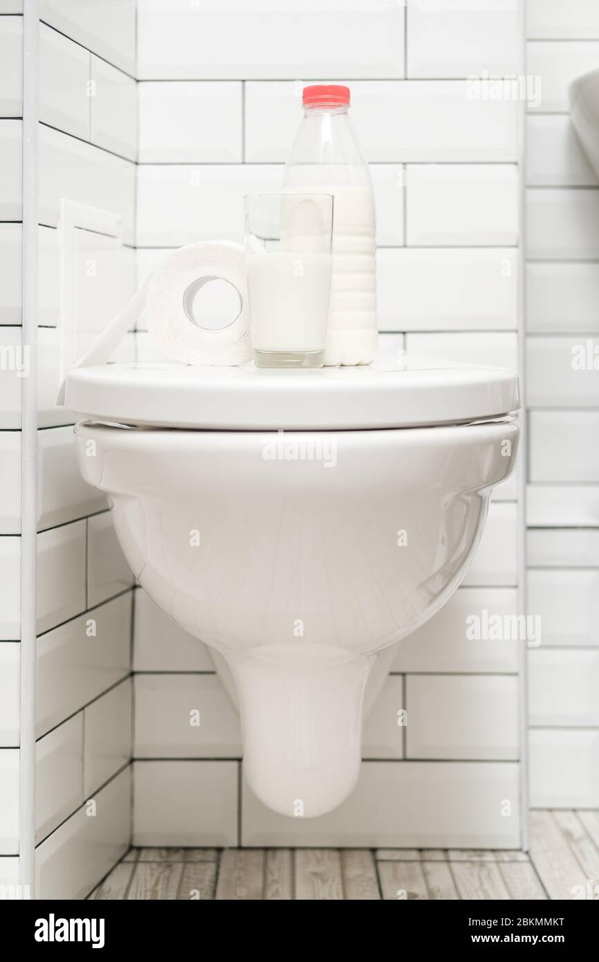 Lactose intolerance. Glass of milk, a bottle of dairy product and a