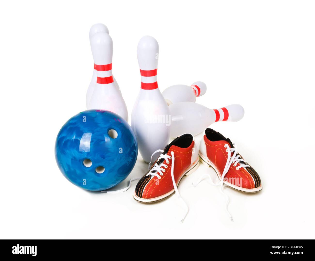 Bowling skittles, ball and shoes on a white background. Bowling game Stock Photo