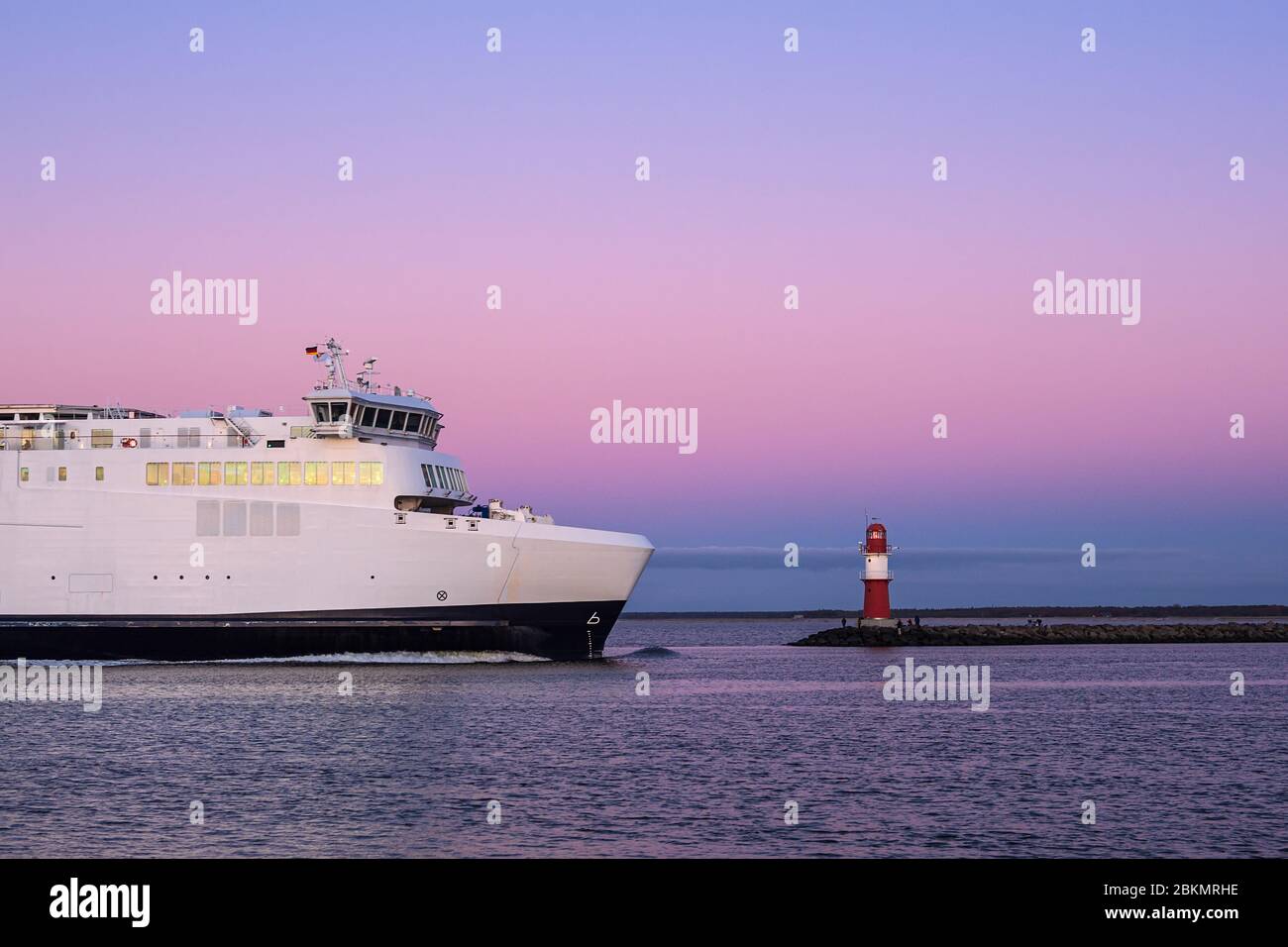 Mole and ferryboat on shore of the Baltic Sea in Warnemuende, Germany. Stock Photo