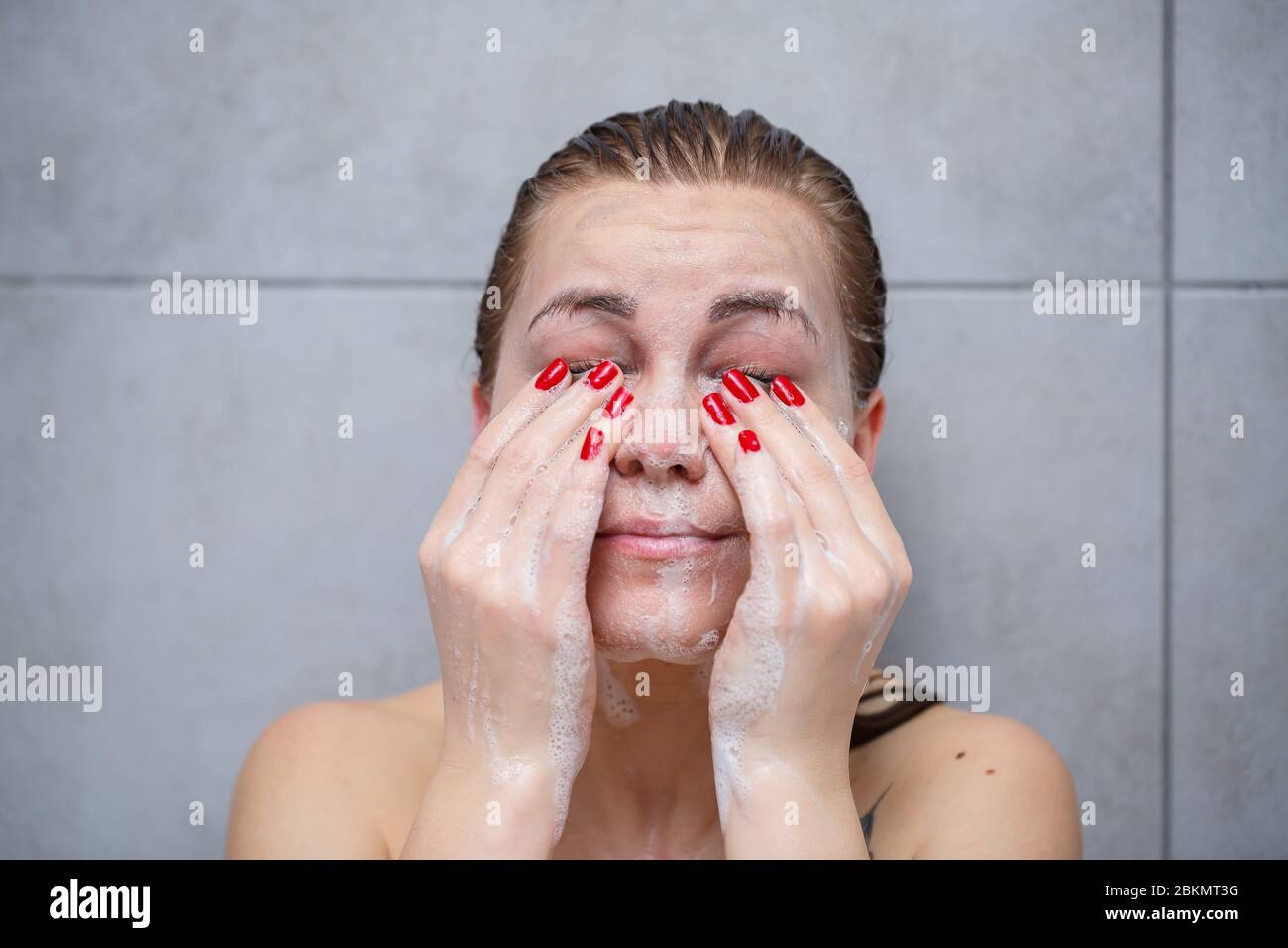 Face Skin Care Woman Applying Facial Cleanser On Face Closeup Girl