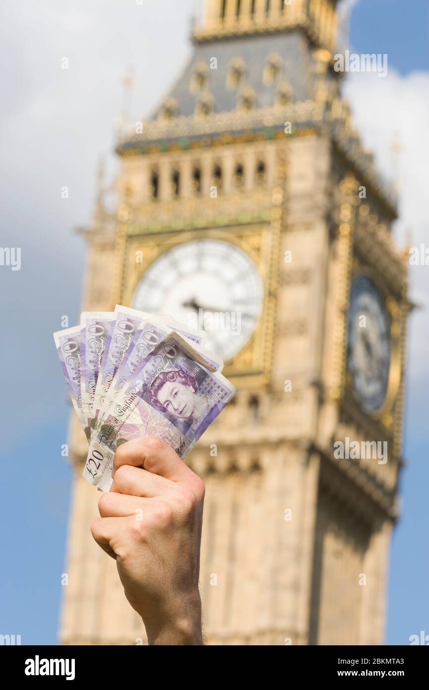 Handful, of £20 notes being held up out the House of Commons, to represent on going MPs expenses crisis, London, UK  1 Jun 2009 Stock Photo