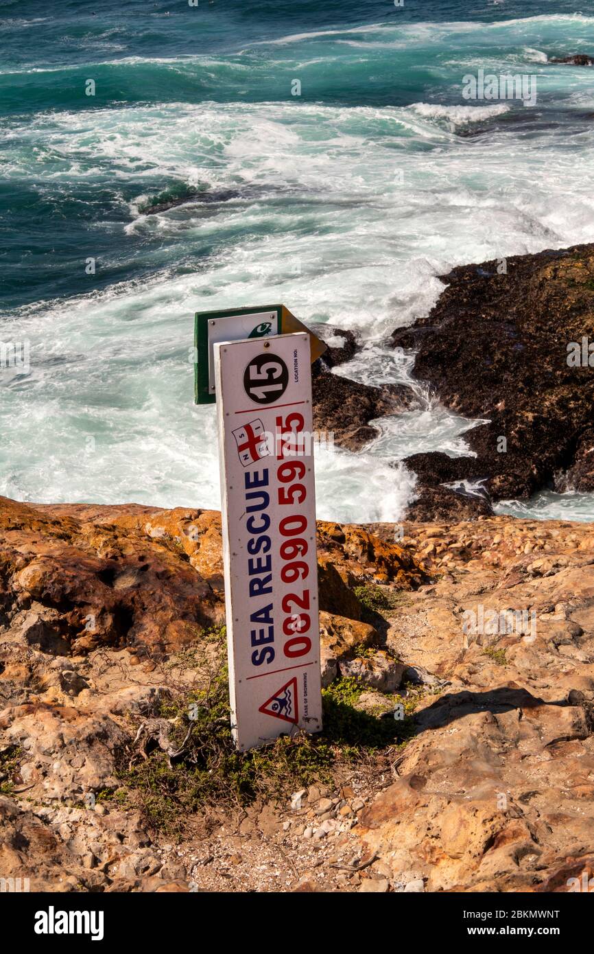 South Africa, Western Cape, Plettenberg Bay, Robberg Nature Reserve, Cape Seal, Sea Rescue location marker 15 on path above rocky coastline Stock Photo