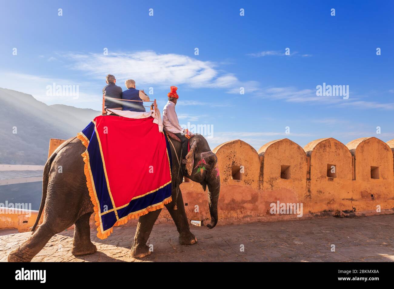 Riding on elephats, famous tourist attraction in Amber Fort of Jaipur, India Stock Photo