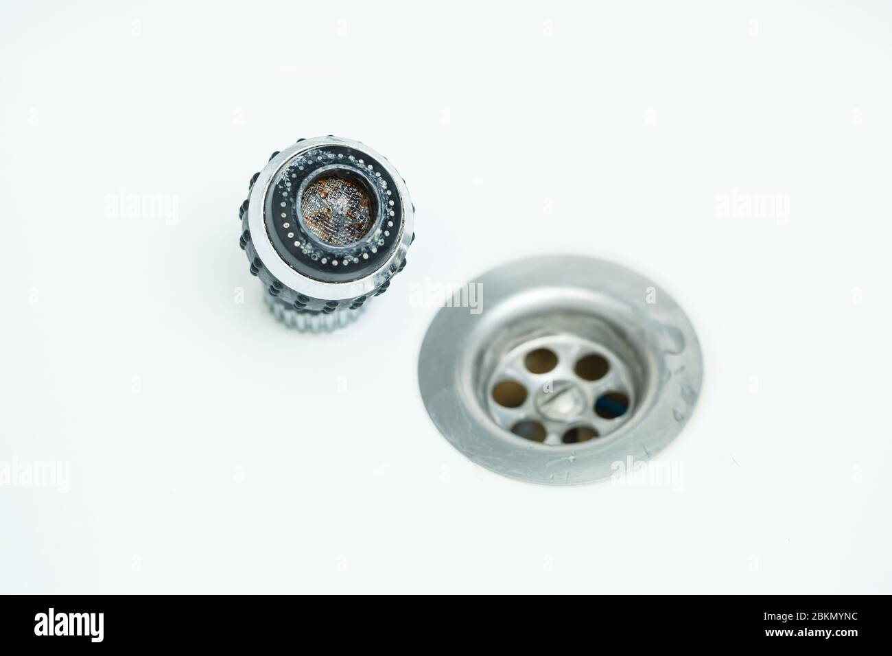 Rotary nozzle on the mixer to adjust the flow of water. White bathroom