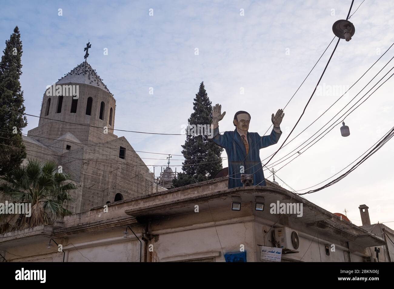 A depiction of Hafaz Al-Assad outside an Christian Orthodox Church in Qamishli. The Syrian Regime's narrative of protecting religious minorities remains strong in some areas of the country. Stock Photo