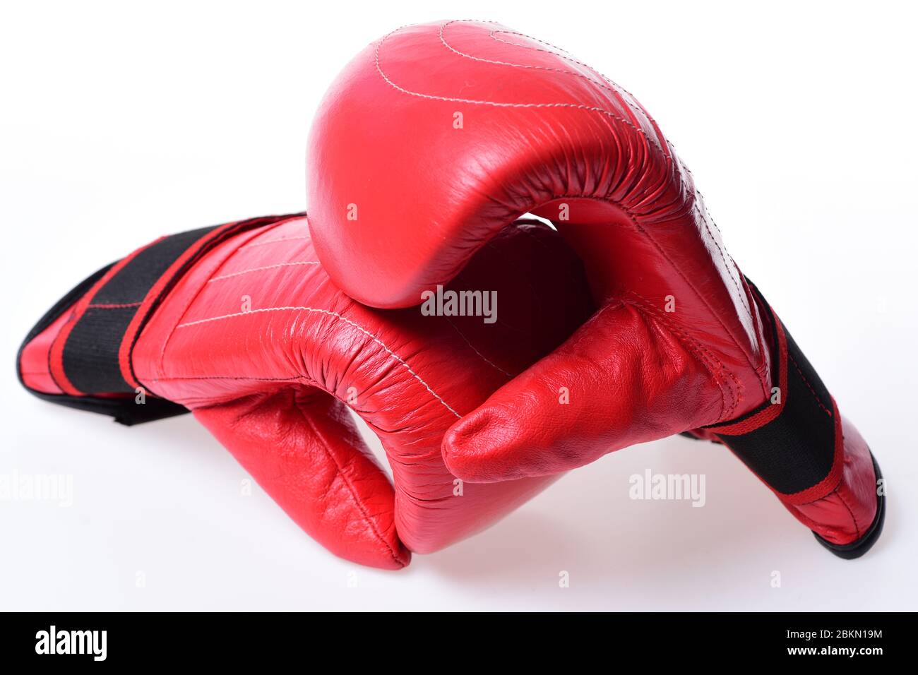 Leather box equipment for fight and training. Pair of boxing gloves lying  on each other. Combat and fight concept. Boxing gloves in red color  isolated on white background Stock Photo - Alamy