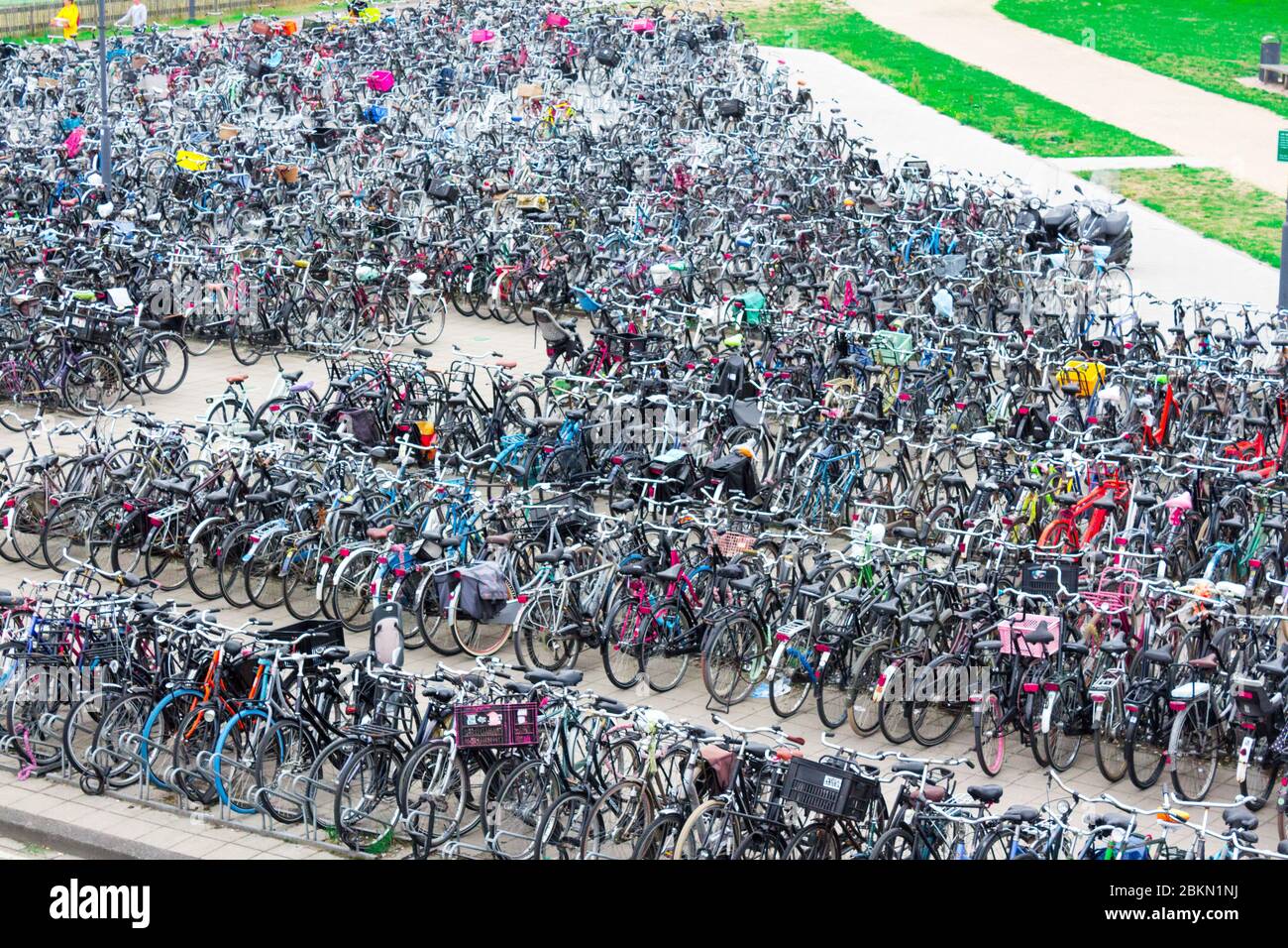 The Netherlands August 20, 2020.  Bicycle parking with bicycles parked near the train station, sunny day, Netherlands Stock Photo